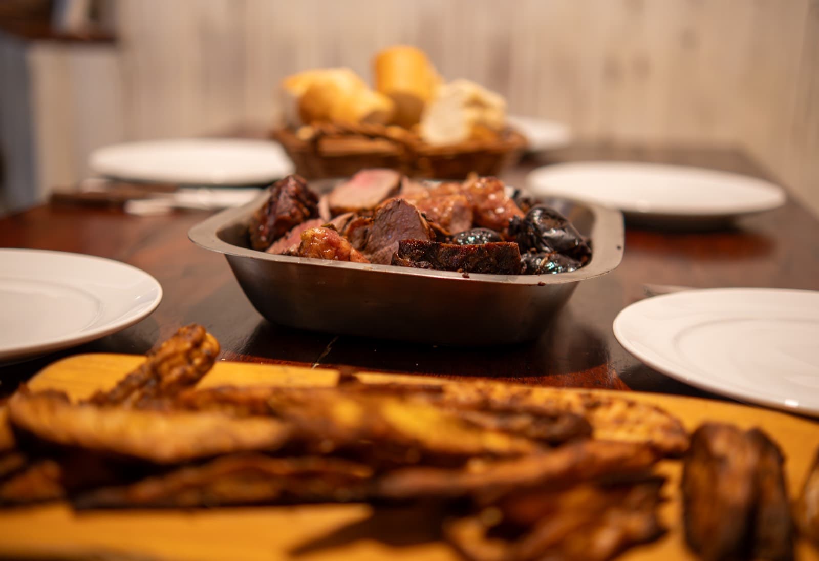 A full asado spread around the table on a Patagonia ski week