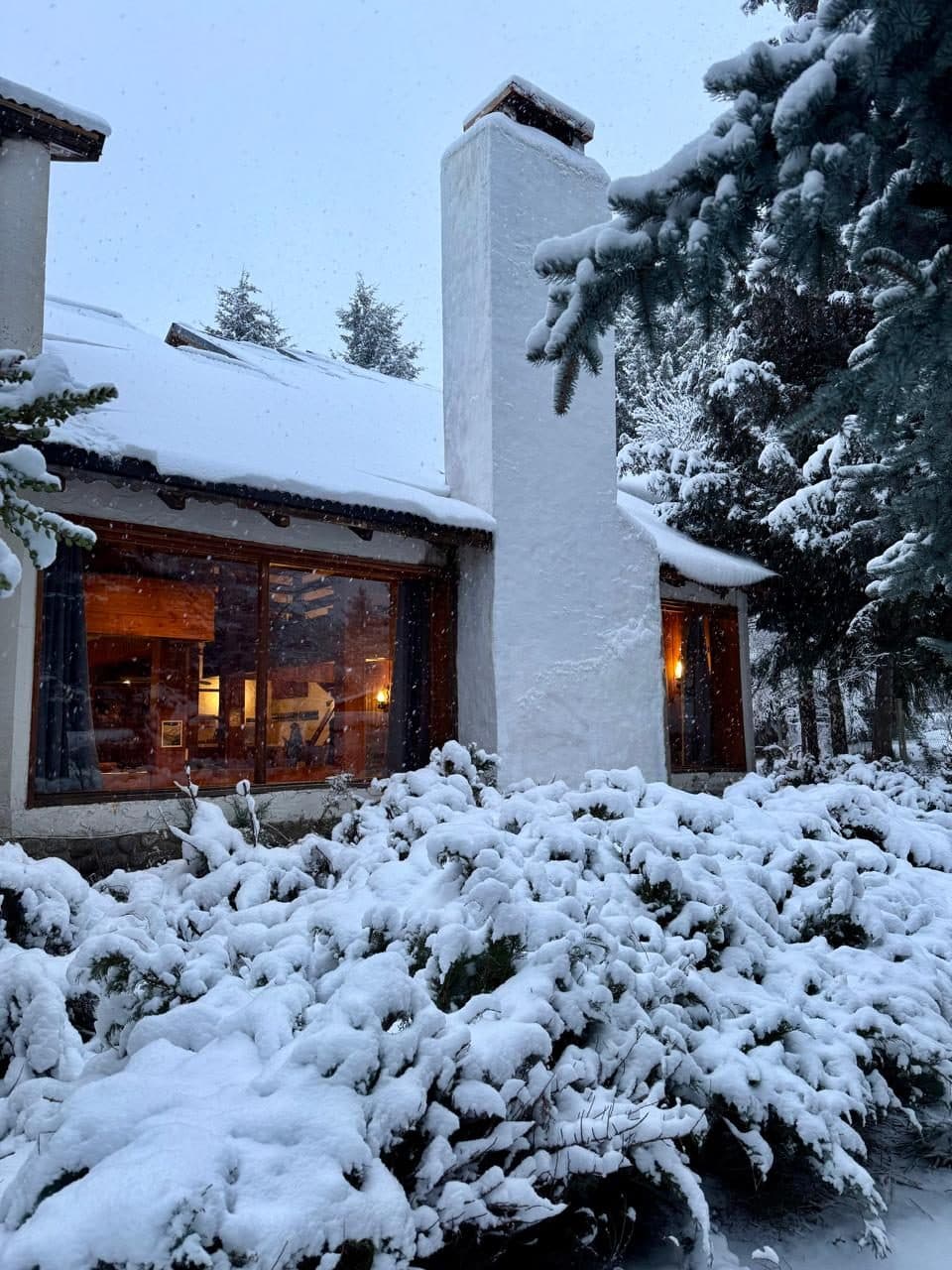 The Social Lodge exterior at dusk in Villa Catedral